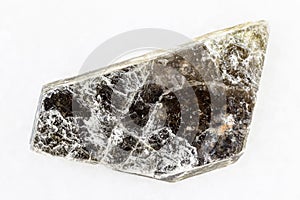 Raw muscovite common mica on white marble