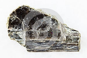 raw muscovite mica stone on white marble photo