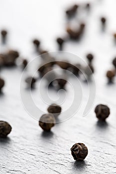 Raw, natural, unprocessed black pepper peppercorns macro photo