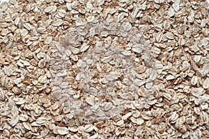 Raw oat flakes on white background