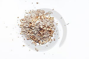 Raw oat flakes on white background