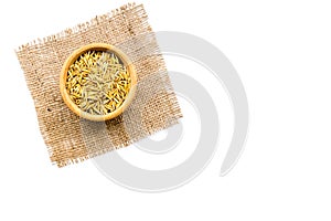 Raw oats in bowl on white background top view copy space