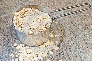 Raw Oats in a measuring cup
