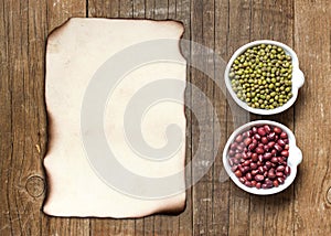 Raw Organic azuki and mung beans and old paper