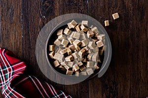 Raw Organic Brown Sugar Cubes in Wooden Bowl Ready to Eat