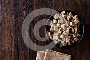 Raw Organic Brown Sugar Cubes in Wooden Bowl Ready to Eat