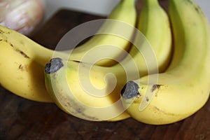 Raw organic bundle of ready-to-eat bananas. Close-up with blur photo
