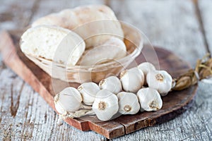 Raw organic garlic on kitchen table