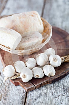 Raw organic garlic on kitchen table