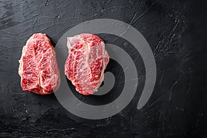 Raw organic meat Top Blade steaks or Australia wagyu oyster blade on black background top view space for text