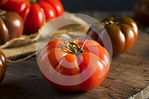 Raw Organic Red and Brown Heirloom Tomatoes photo