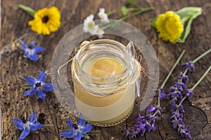 Raw organic royal jelly in a small bottle
