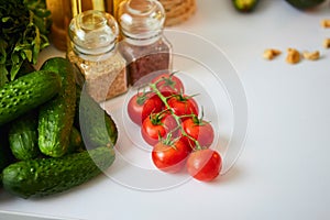 Raw organic vegetables, fruits and nuts with fresh ingredients for healthily cooking on kitchen. Vegan or diet food concept.