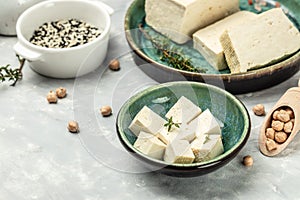 Raw organic vegetarian tofu cubes. Food recipe background. Close up