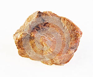 raw orthoclase stone on white photo