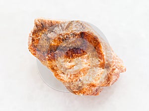 raw orthoclase stone on white marble