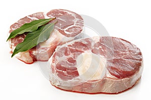 Raw oxtail with bay leaf