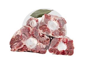 Raw oxtail cut isolated with spieces and white fresh herbs