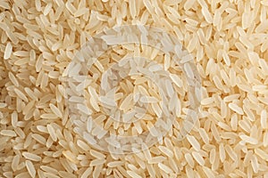 Raw parboiled rice as background