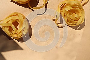 Raw pasta on a bodily background