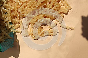 Raw pasta on a bodily background
