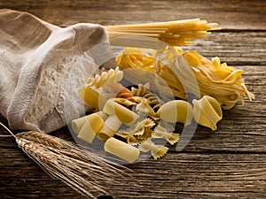 Raw pasta with ears and flour