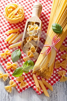 Raw pasta farfalle spaghetti penne tagliatelle. italian cuisine