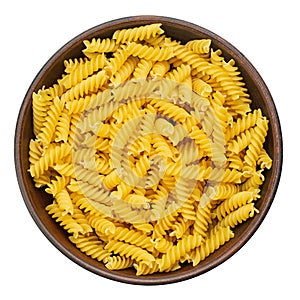 Raw pasta Fusilli in bowl isolated on white background. Raw and Dry Macaroni. Italian Culture