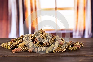 Raw pasta fusilli with curtains