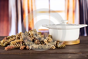 Raw pasta fusilli with curtains