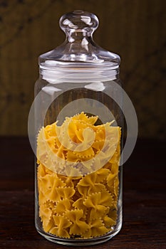 Raw pasta on glass jar