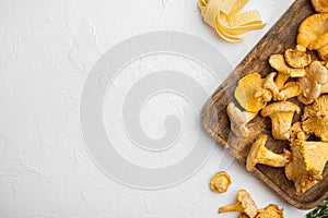 Raw pasta and mushrooms and ingredients, on white stone table background, top view flat lay, with copy space for text