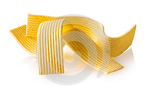 raw pasta noodles on white isolated background