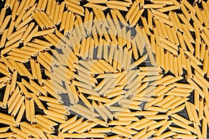 raw pasta is scattered on the table