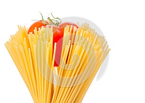 Raw pasta spaghetti with tomato inside on white background with space for text