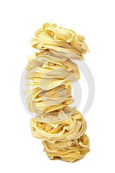 Raw pasta tagliatelle isolated photo
