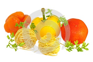 Raw pasta with tomato, peppers and greens isolated