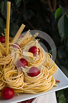 Raw pasta and tomatoes.