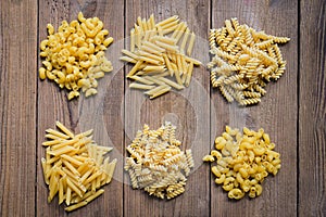 Raw pasta various kinds of uncooked pasta macaroni spaghetti and noodles, Italian food culinary concept, Collection of different