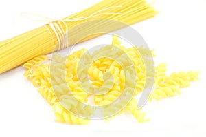 Raw pasta on white background