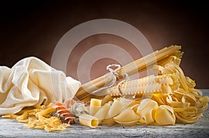 Raw pasta on wood