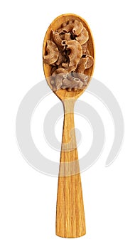 Raw pasta in a wooden spoon isolated on white background. Italian food