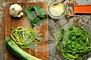 Raw pasta with zucchini and spinach pesto with garlic