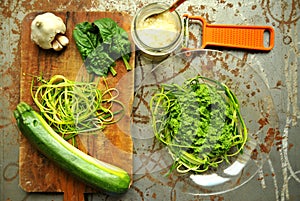 Raw pasta with zucchini and spinach pesto with garlic