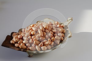 Raw peanut kernel on a white background