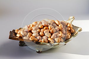 Raw peanut kernel on a white background