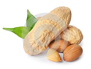 Raw peanuts and leaves on white background