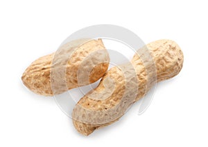 Raw peanuts in pods on white background