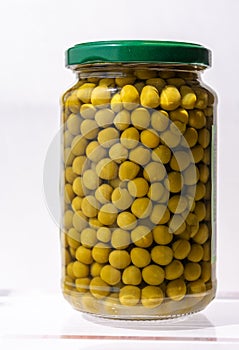 Raw peas packaged in glass jar