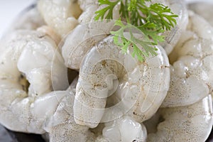 Raw peeled prawns or shrimp photo